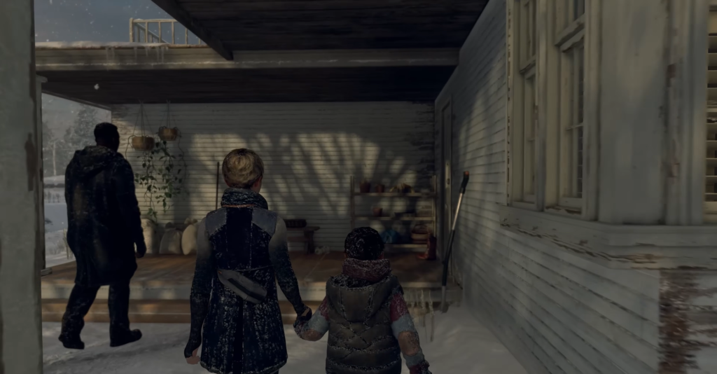 Женщина ведет ребенка по заснеженному крыльцу дома