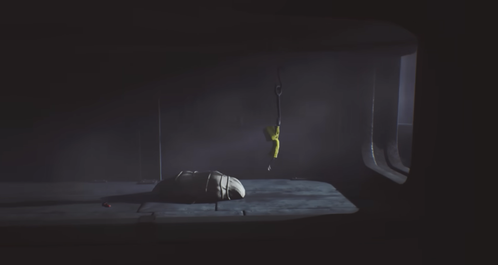 Шестая из Little Nightmares висит на крюке в комнате