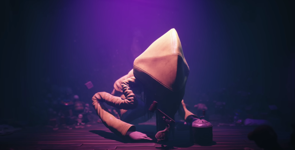 Шестой из Little Nightmares сидит на полу в темноте