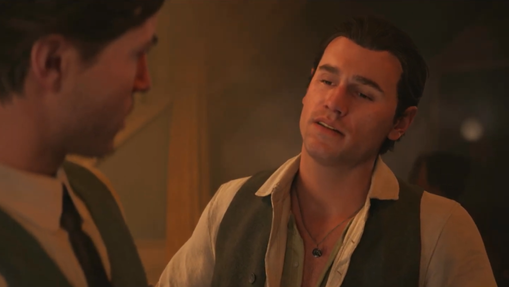 Два мужчины разговаривают в помещении при тёплом свете