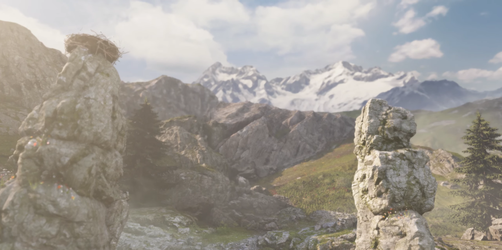 Скальные столбы на горном лугу на фоне снежных вершин