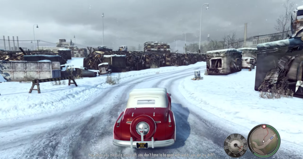 Красный кабриолет едет по заснеженной дороге в Mafia II