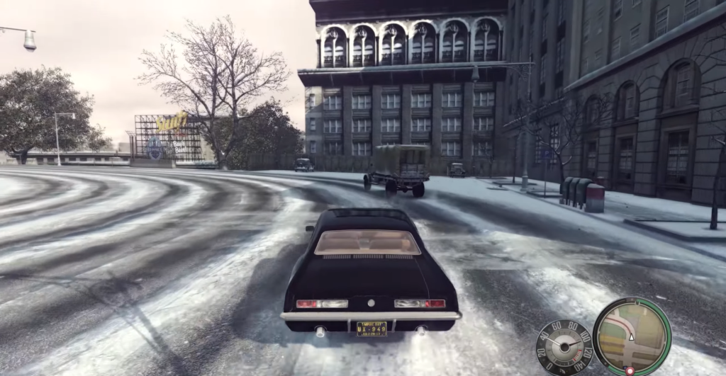 Машина едет по заснеженной улице в Mafia II