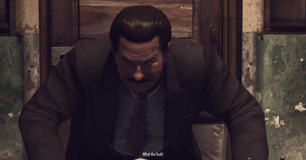 Мужчина в костюме наклоняется в комнате Mafia II