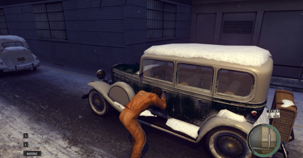 Персонаж Mafia взламывает замок машины на снегу