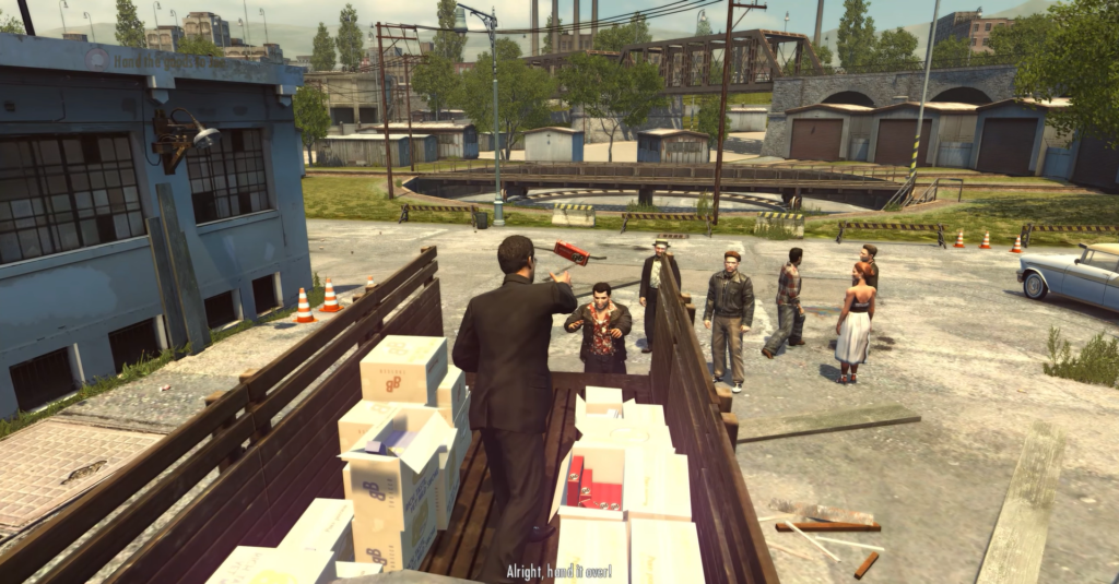 Макс Пэйн целится в мужчину на складе Max Payne 3