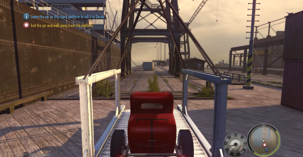 Красный автомобиль едет по крановой платформе в Mafia II
