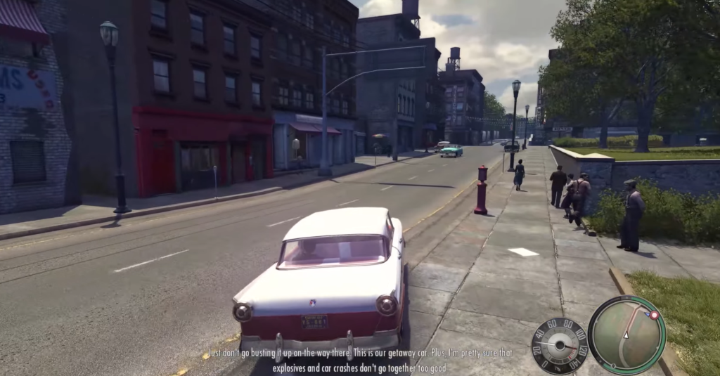 Белый автомобиль едет по улице в Mafia II