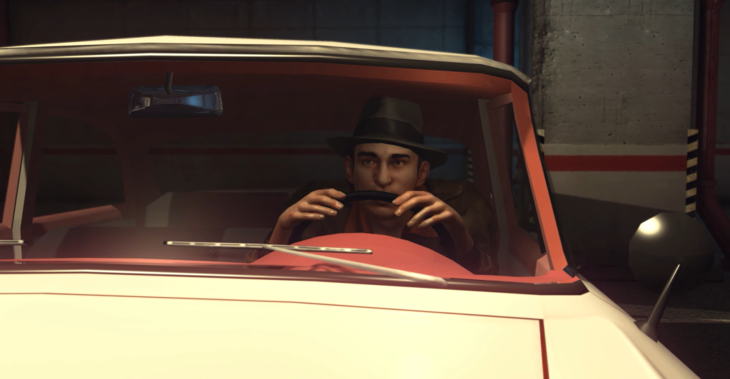 Мужчина в шляпе держит руль в машине в гараже