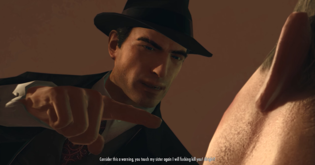 Мужчина в черной шляпе угрожает пальцем в помещении