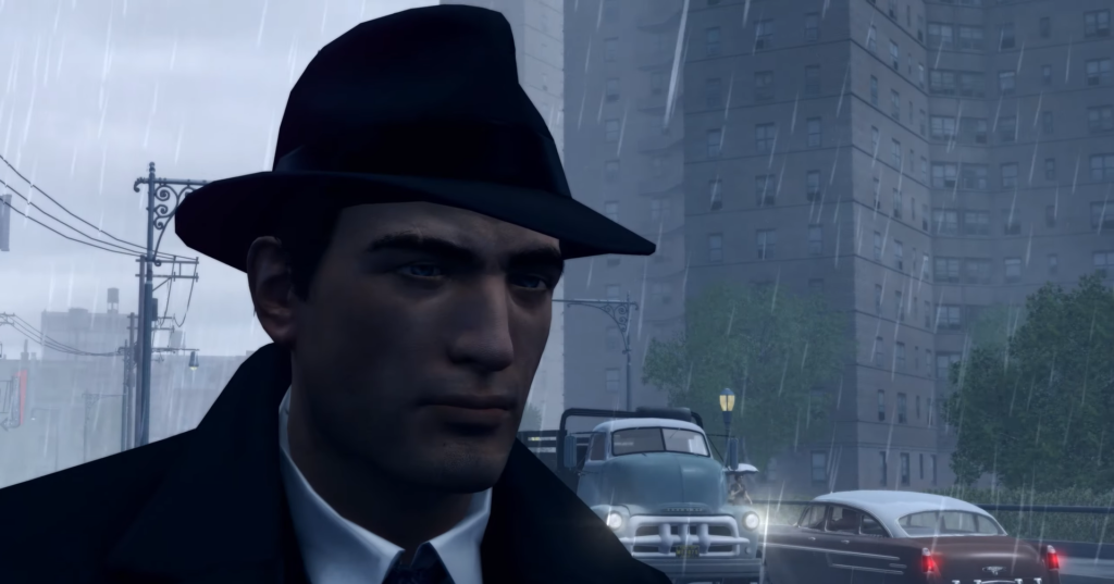 Томми Анджело из Mafia стоит под дождём на улице