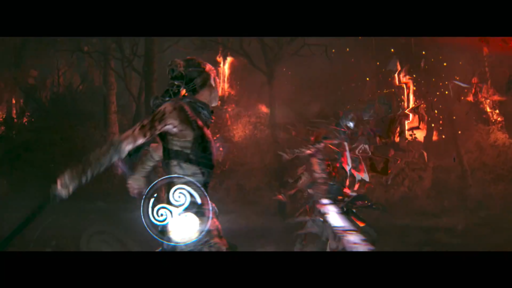 Воин сражается с монстром в горящем лесу