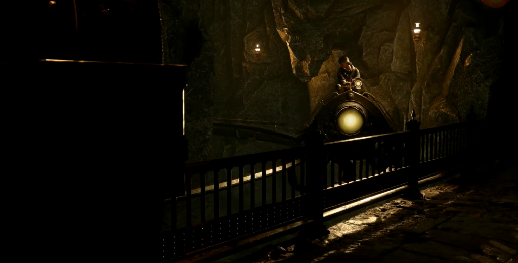 Шахтёр едет на дрезине в тёмной шахте