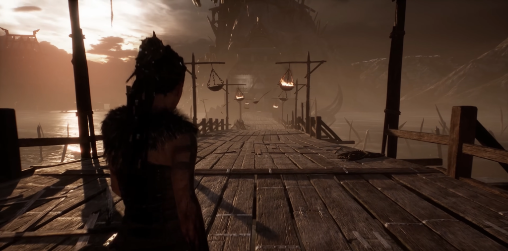 Сенуа из Hellblade идет по деревянному мосту