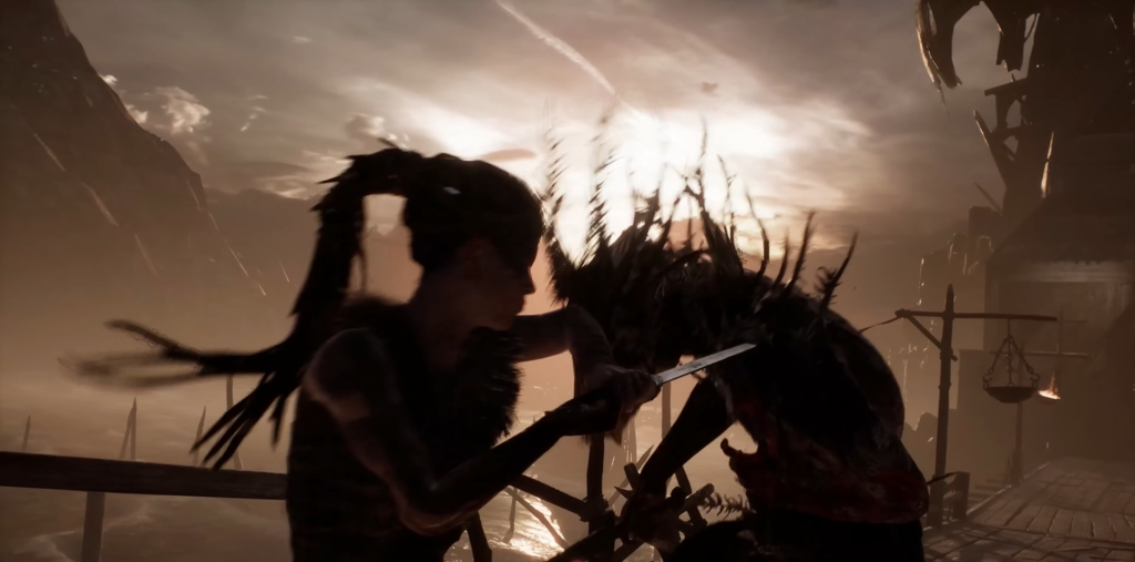 Сенуа из Hellblade сражается с врагом на мосту