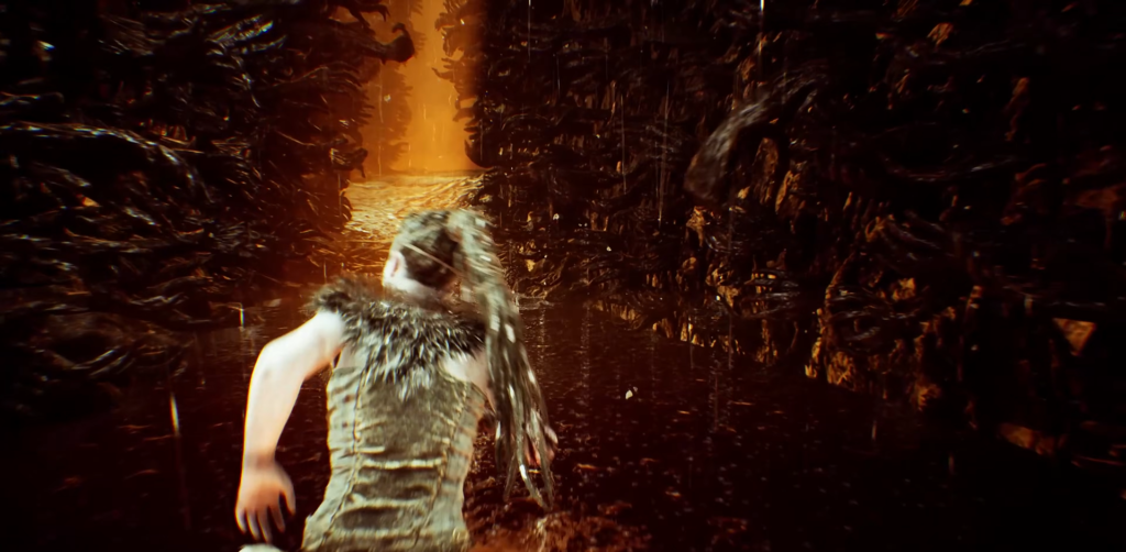 Сенуа бежит по узкому ущелью в Hellblade: Senua's Sacrifice