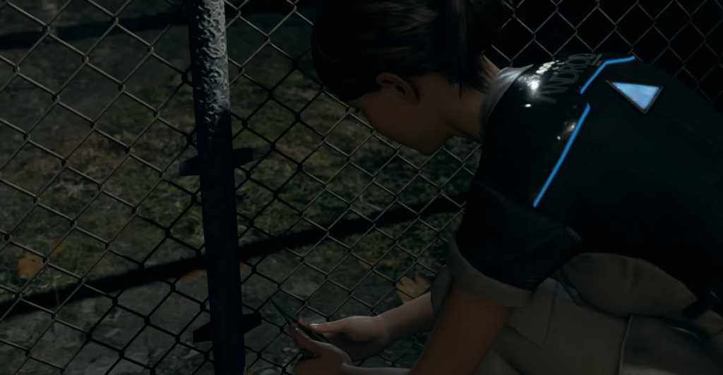 Кара из Detroit: Become Human режет сетку забора