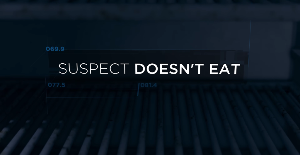 Текст «SUSPECT DOESN'T EAT» на тёмном фоне