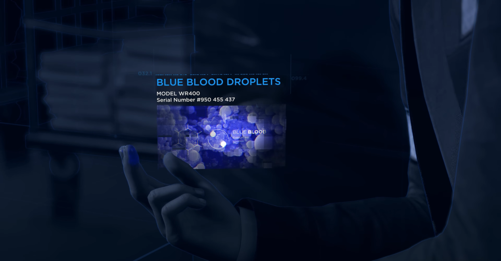 Рука держит голограмму с надписью Blue Blood Droplets