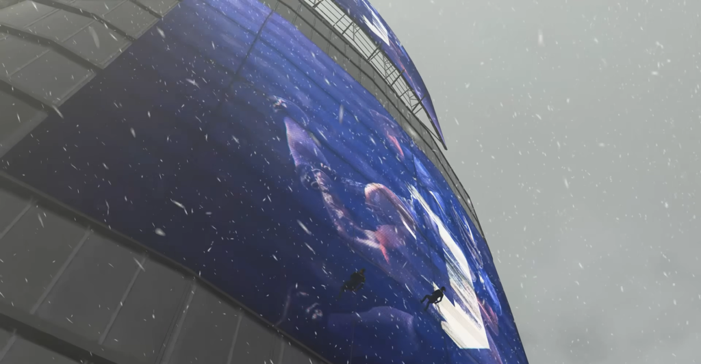 Альпинисты спускаются по синему фасаду здания в снегопад