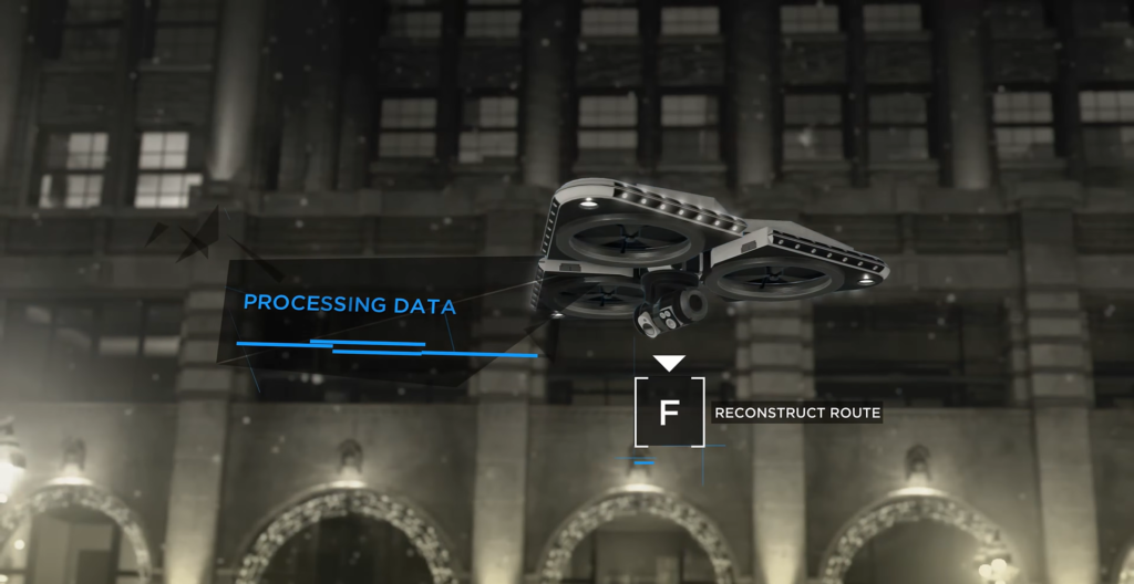 Дрон сканирует маршрут у здания ночью в снегопад