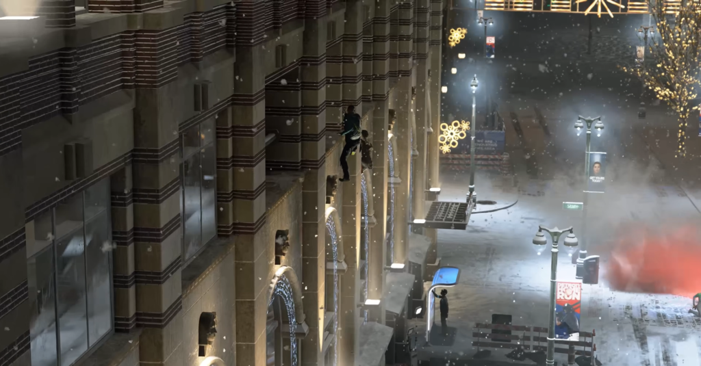 Человек карабкается по стене здания ночью в снегопад