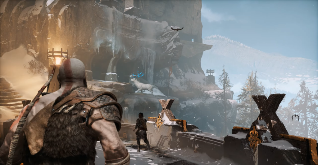 Кратос идет по снежному мосту в God of War