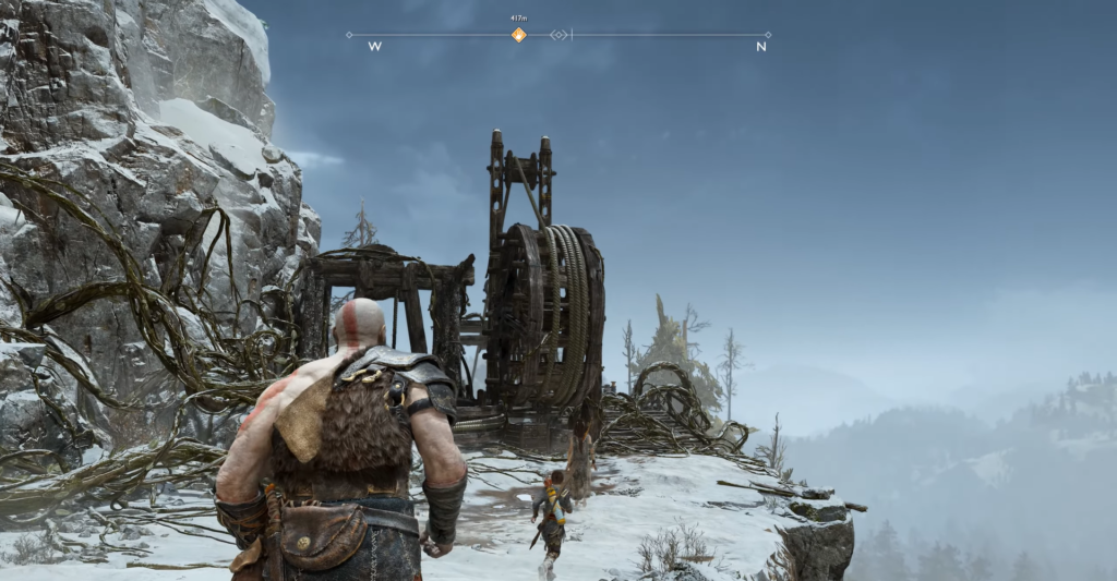 Кратос идет к лебедке на снежной скале