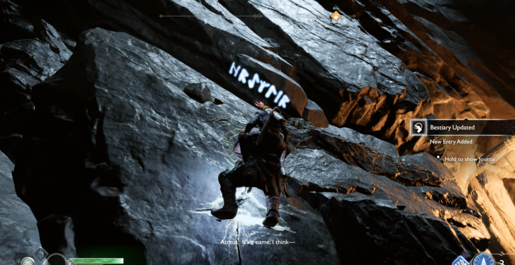 Атрей карабкается по скале в God of War Ragnarok