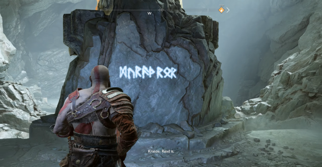 Кратос читает руны на камне в пещере God of War