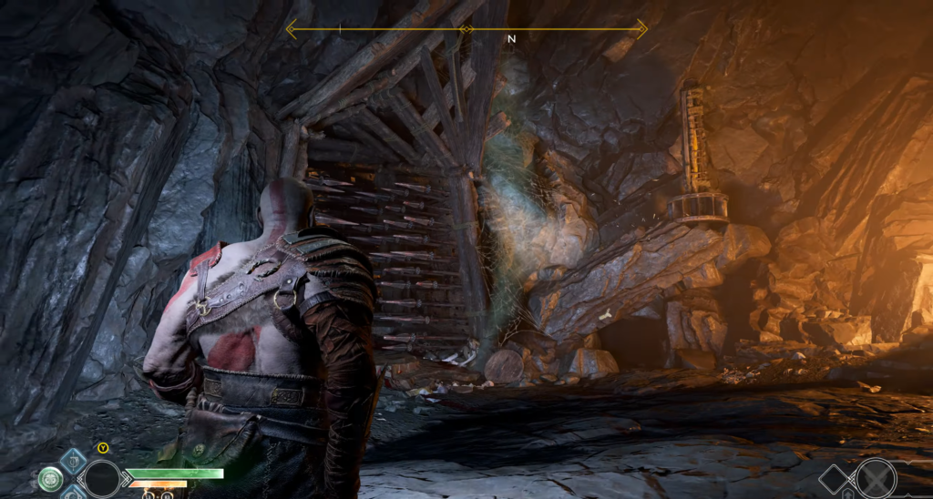 Кратос стоит в пещере God of War