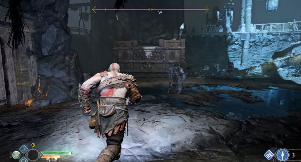 Кратос бежит по пещере в God of War