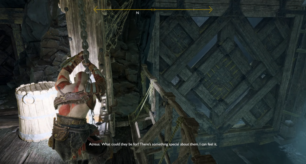 Кратос из God of War тянет цепь в шахте