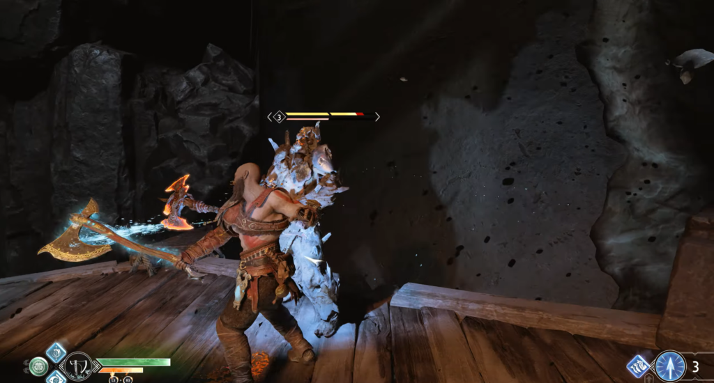 Кратос из God of War атакует врага в пещере