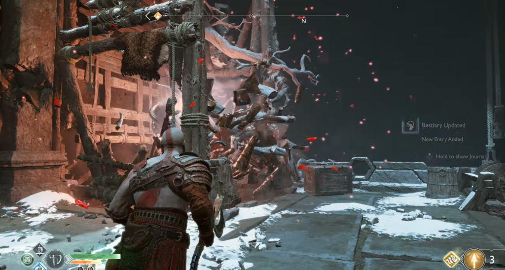 Кратос сражается с монстром в снежных руинах God of War