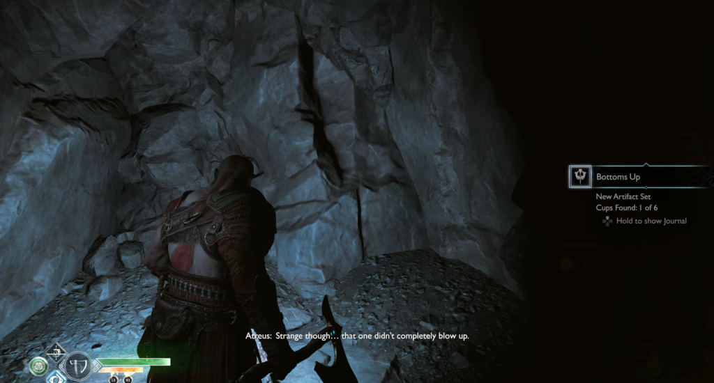 Кратос из God of War стоит в пещере