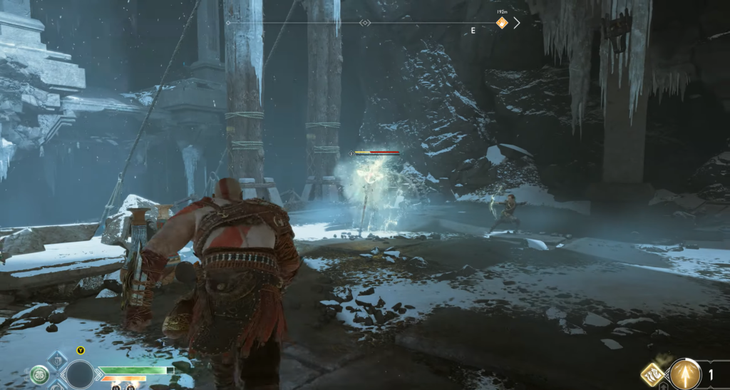 Кратос сражается с врагом в снежных руинах God of War