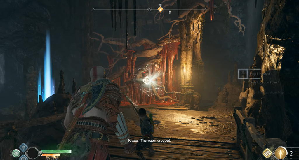 Кратос и Атрей идут по пещере God of War