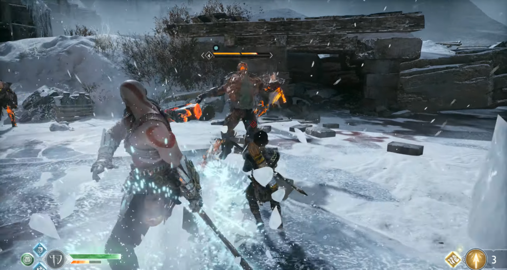 Кратос и Атрей сражаются с огненным троллем в снегу