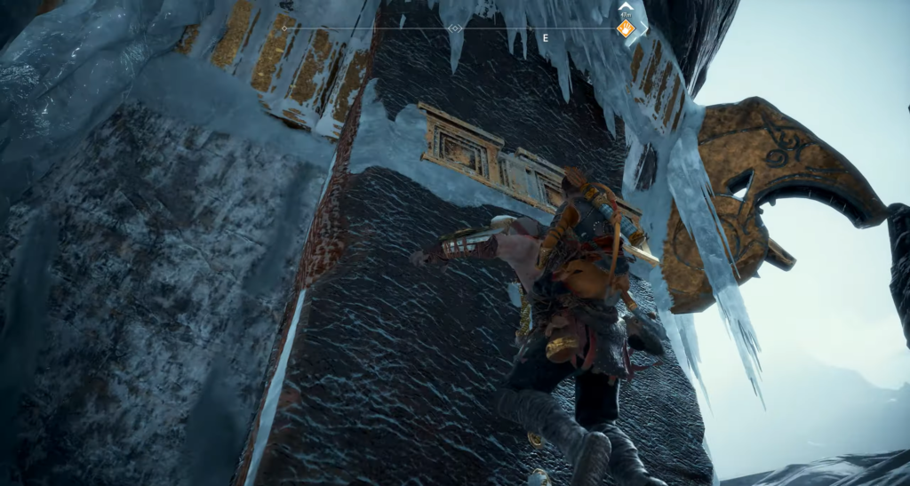 Кратос из God of War карабкается по ледяной скале