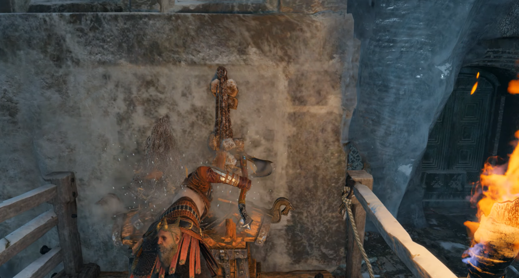 Кратос из God of War открывает сундук у стены