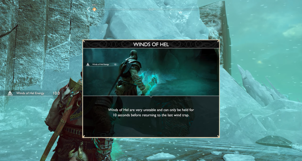 Кратос держит голубую магию в ледяной пещере God of War