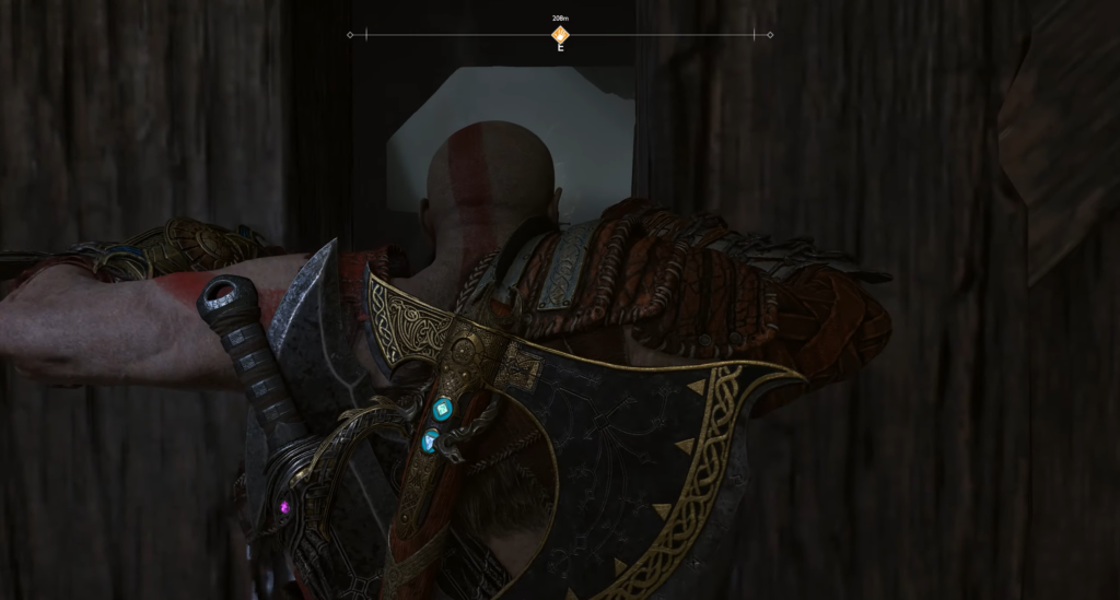 Кратос пролезает через узкий проход в God of War