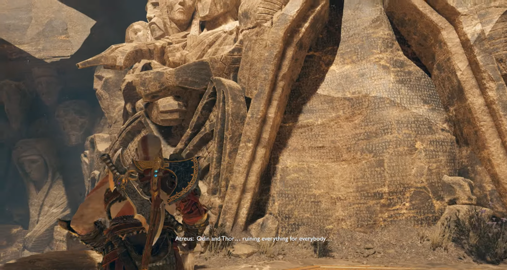 Кратос из God of War стоит у каменной стены