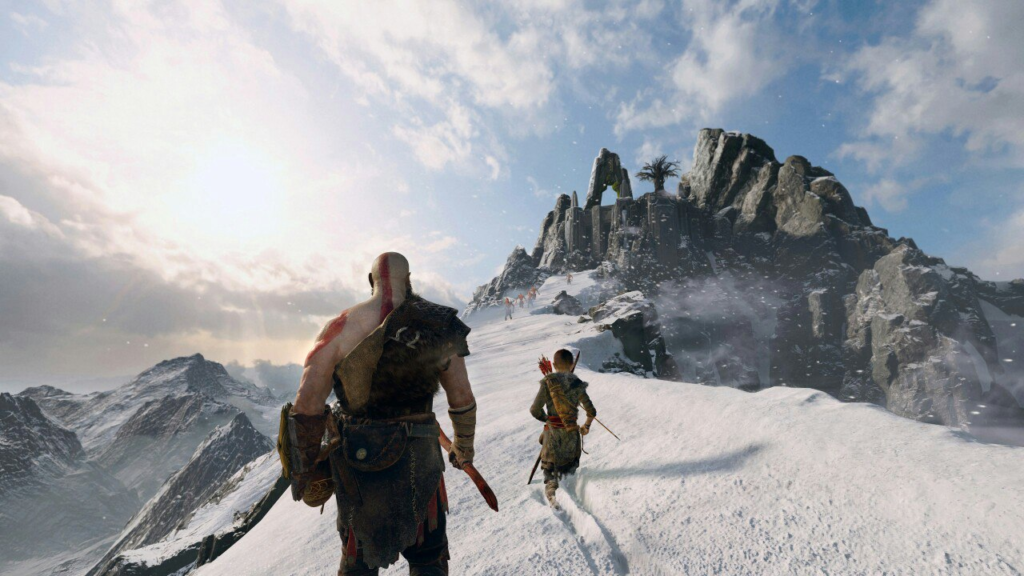 Кратос и Атрей идут по снежной горе God of War