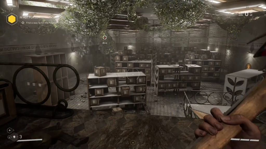 Gloved hand holding cable near blue robot faceplate