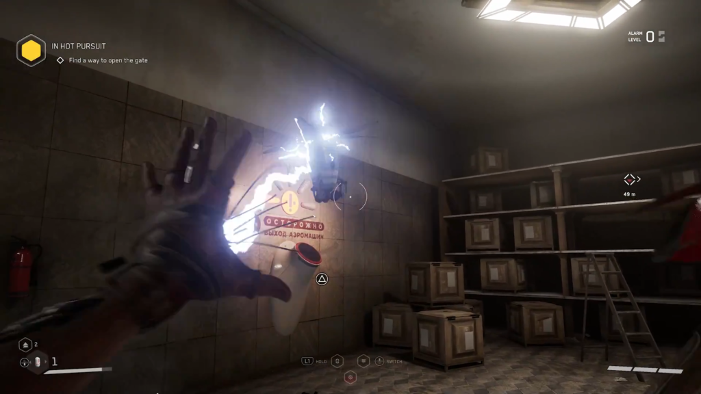 Trapped man crouching beside crates in dark room