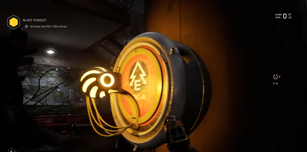 Player aims weapon at control panel in workshop