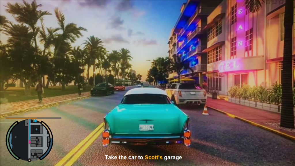 Бирюзовый автомобиль едет по улице мимо отеля Ocean