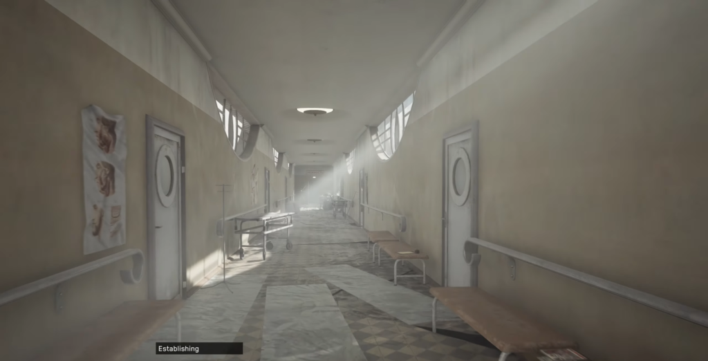 Пустой больничный коридор с каталкой и лавками